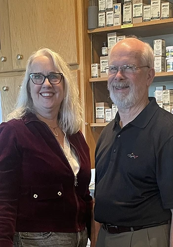 Chiropractors Jeanette Bertani and Douglass Clancy Pose Together for a Photo